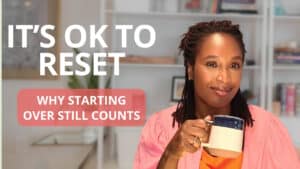 Calm woman enjoying a healthy lifestyle with a mug in a cozy home setting.
